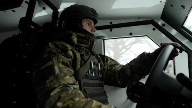 Ukrainian border soldier Vladyslav Piun behind the wheel of Senator.